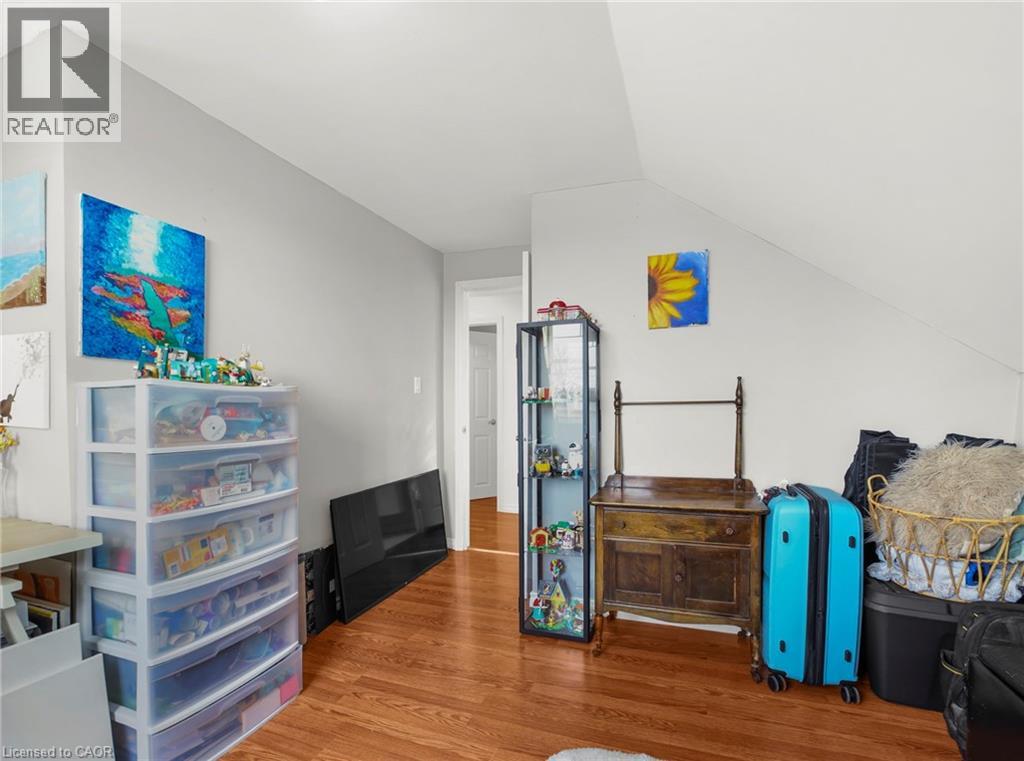 Playroom featuring light wood-style floors and lofted ceiling