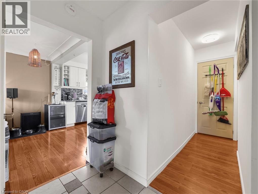 Hallway with light wood-style flooring and beverage cooler