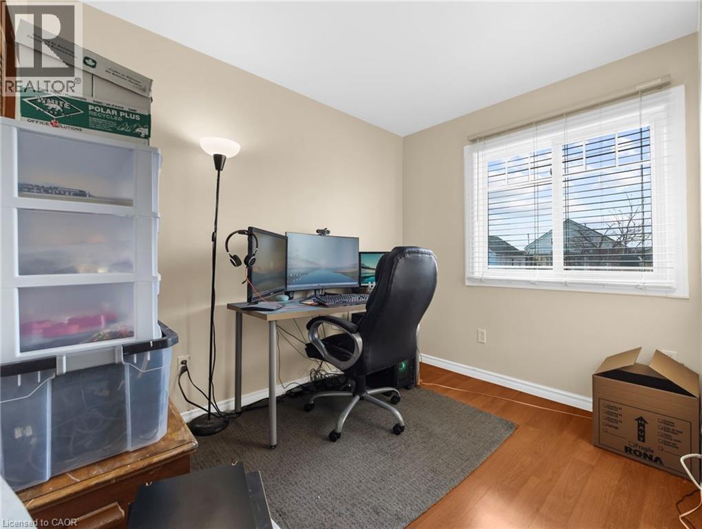 Office space featuring wood finished floors and baseboards