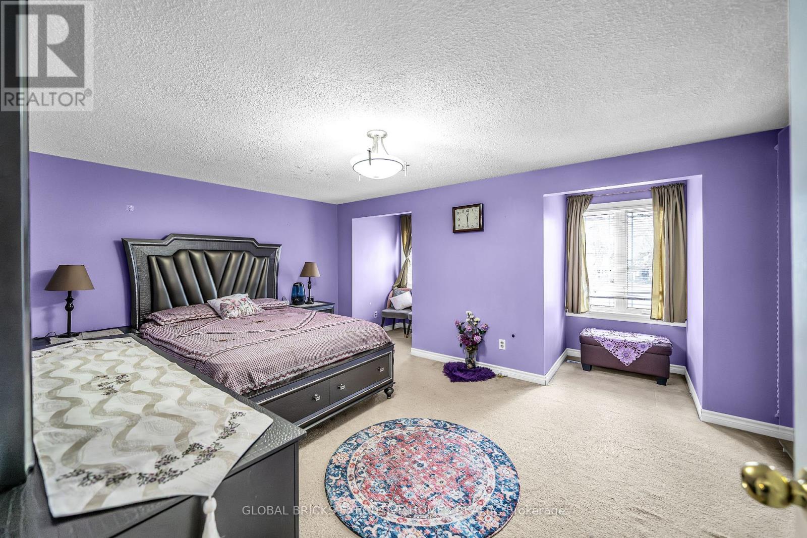 Bright Primary Bedroom Filled with Natural Light