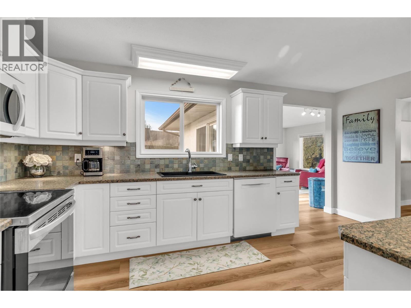 Kitchen leads into dining room and family room