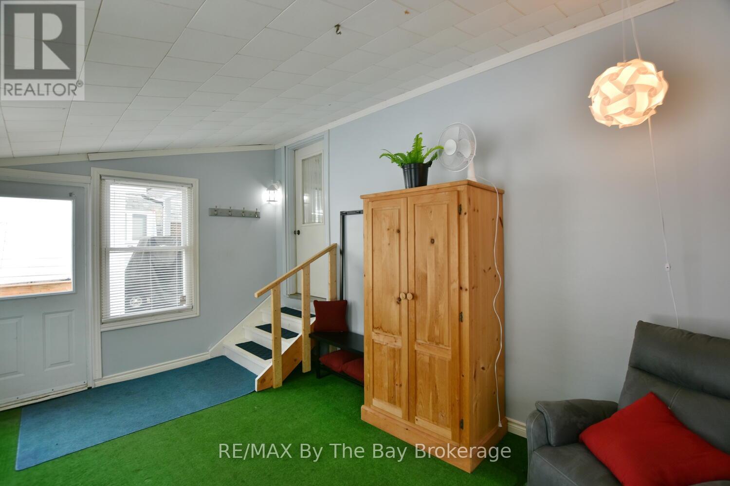 Sunroom with Entrance From Car Port