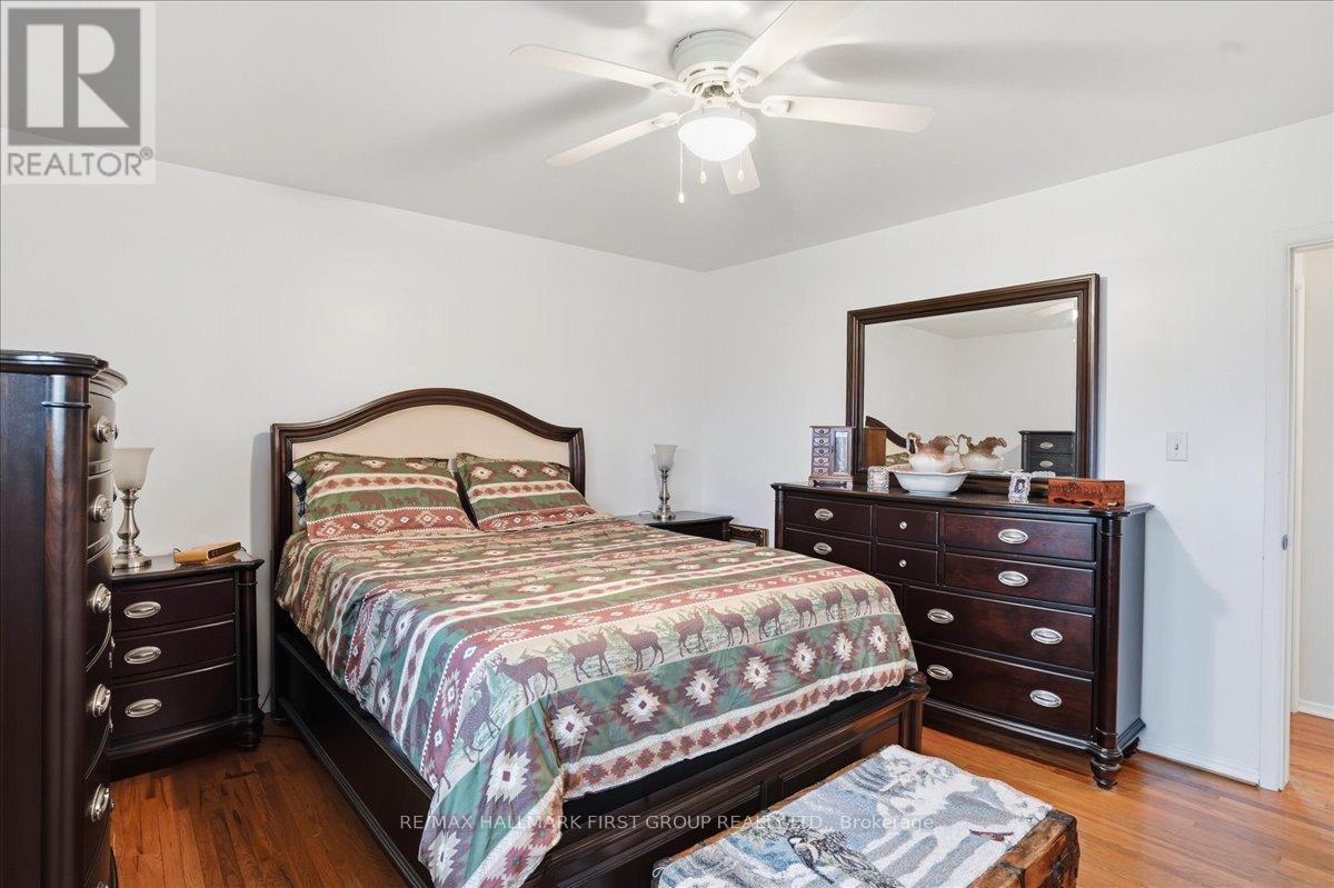 Primary Bedroom with hardwood floors