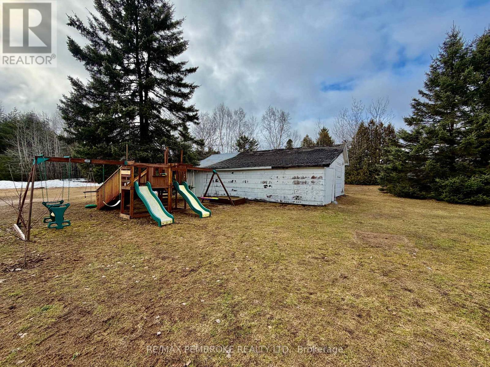 Swingset, sandbox and large shed