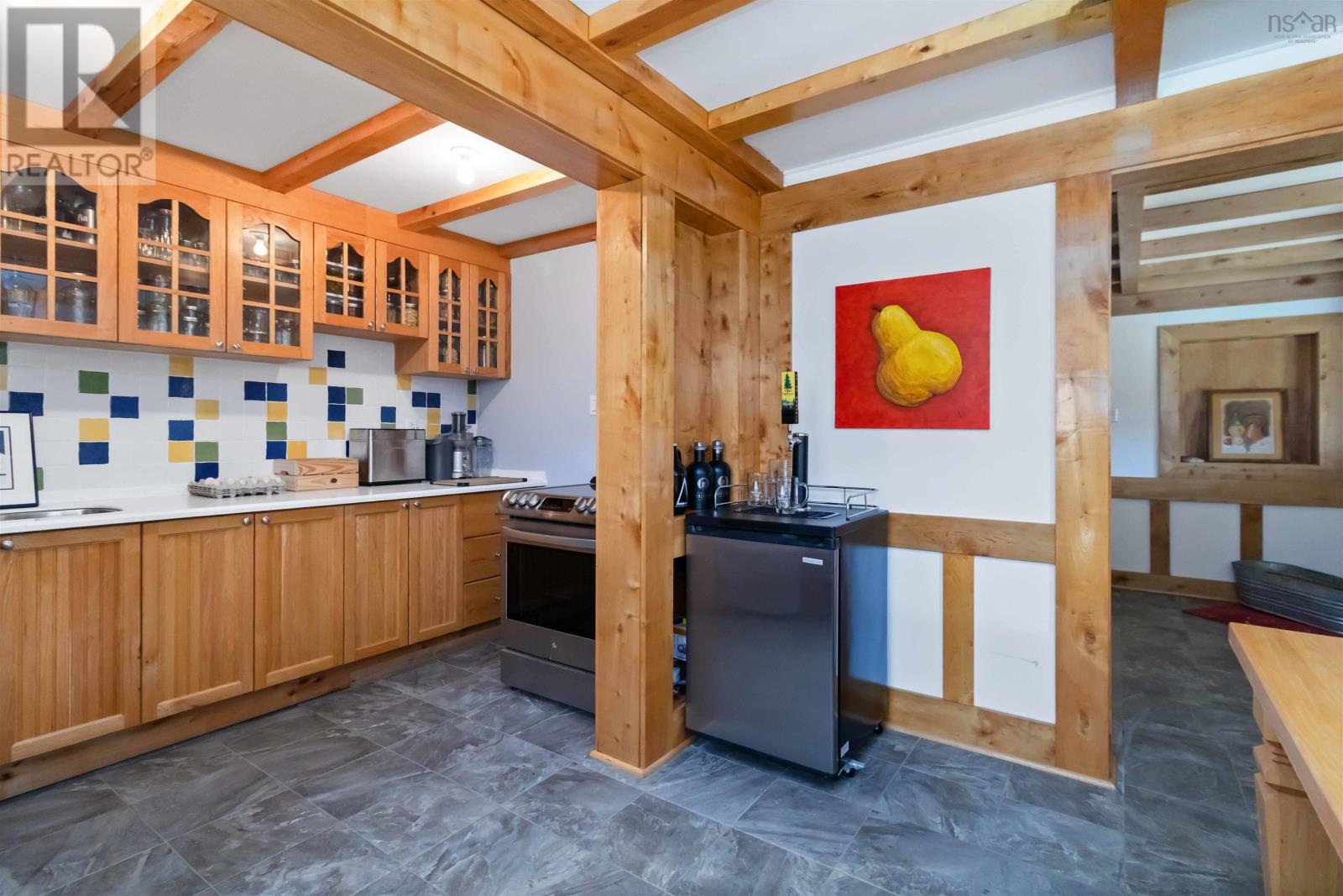 Basement level summer kitchen and eating area.
