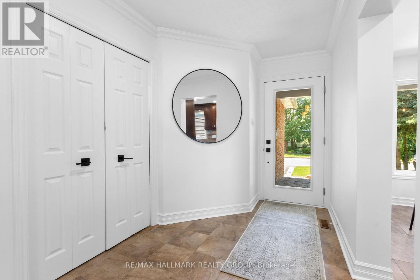 Bright foyer with closet and front door
