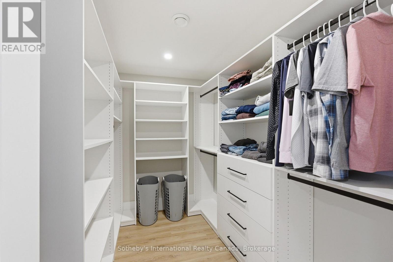 Primary bedroom walk in closet