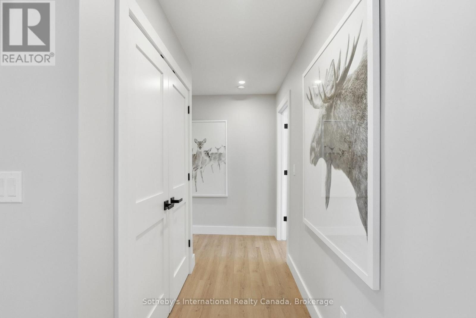 Hallway to 3 bedrooms and 2 bathrooms