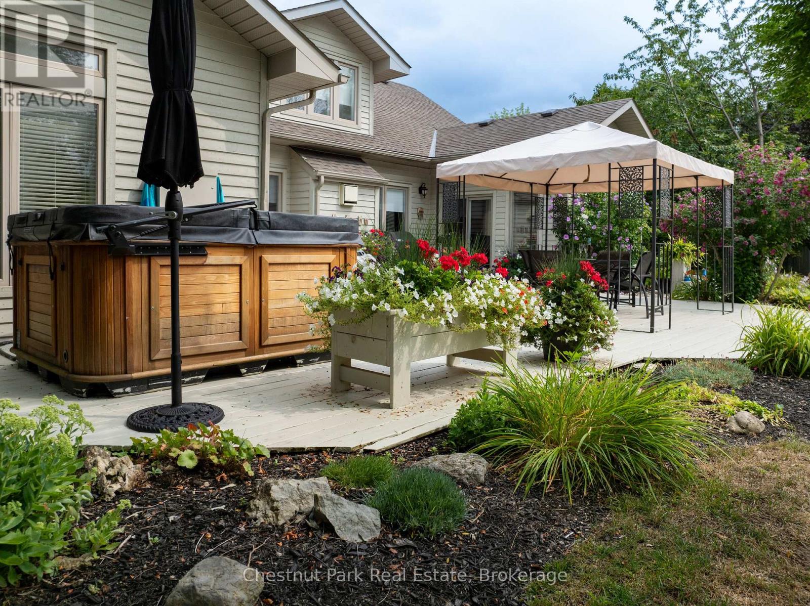 Hot tub on the back deck and off primary bedroom