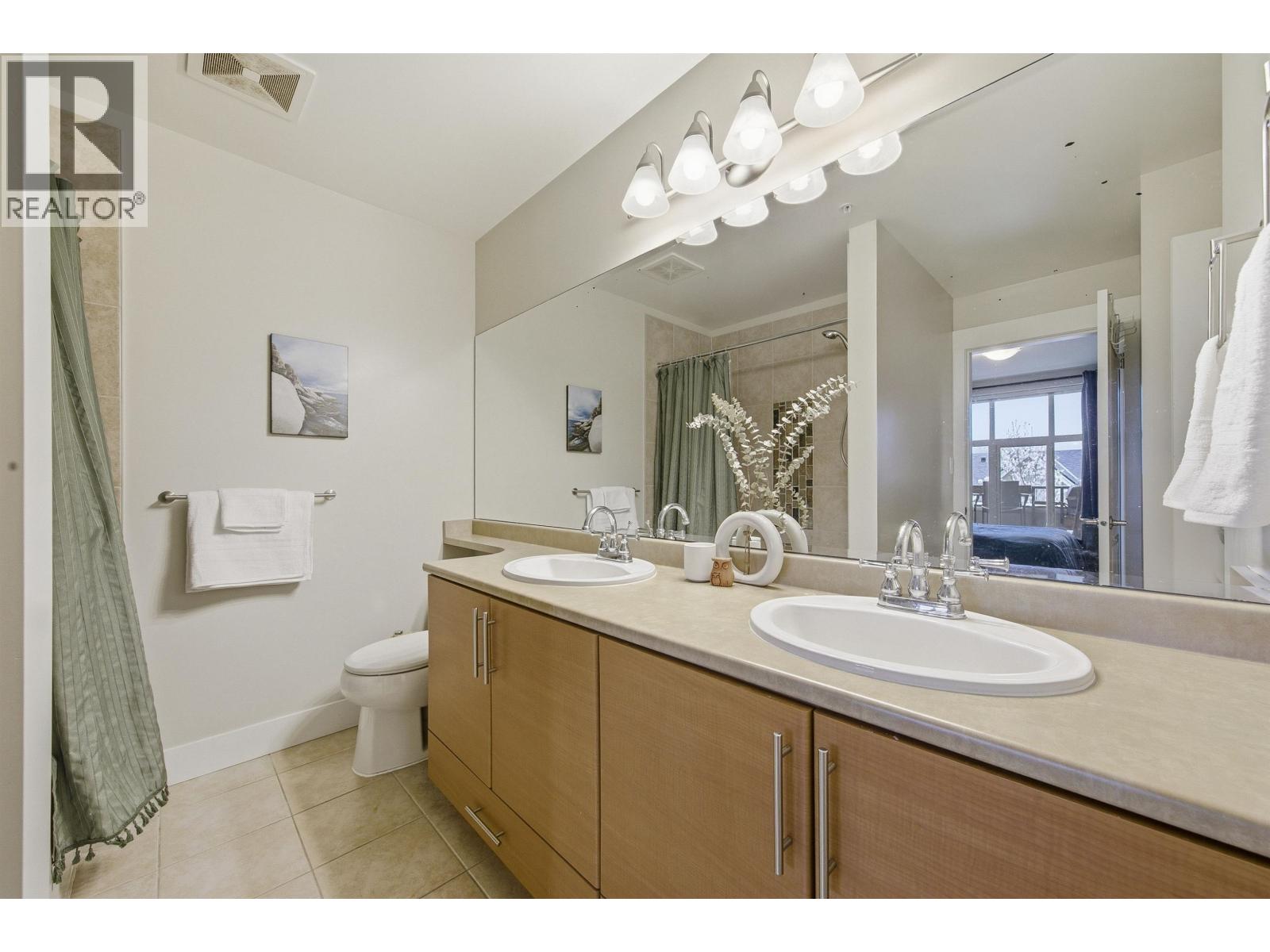 319 1211 VILLAGE GREEN WAY — photo 3