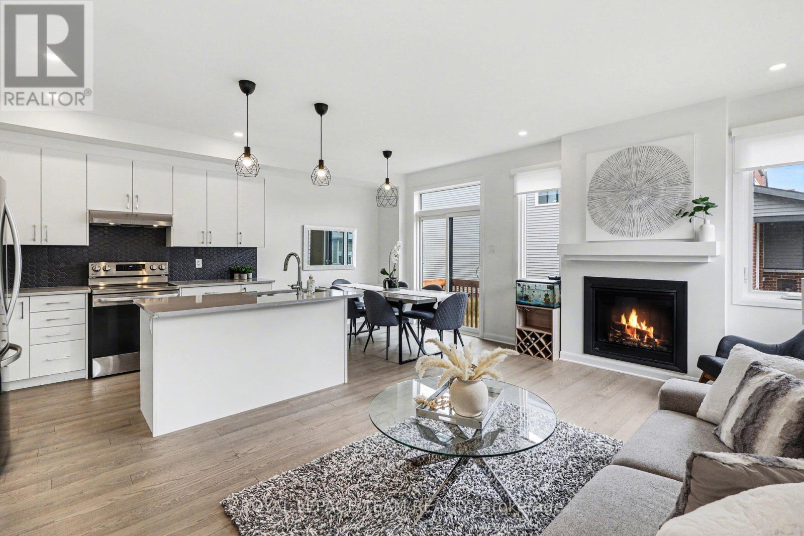 Open concept main floor with pot lights, fireplace
