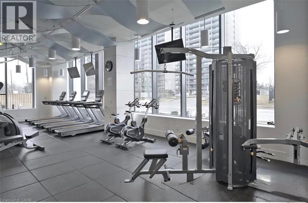 The property features a well-equipped fitness center with various exercise machines, including treadmills, stationary bikes, and weight training equipment