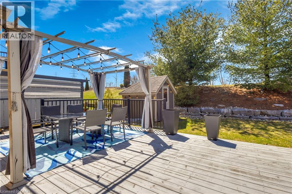 Deck with outdoor dining space and a pergola