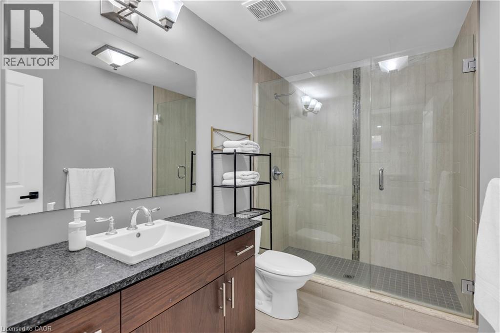 Bathroom with a stall shower and vanity