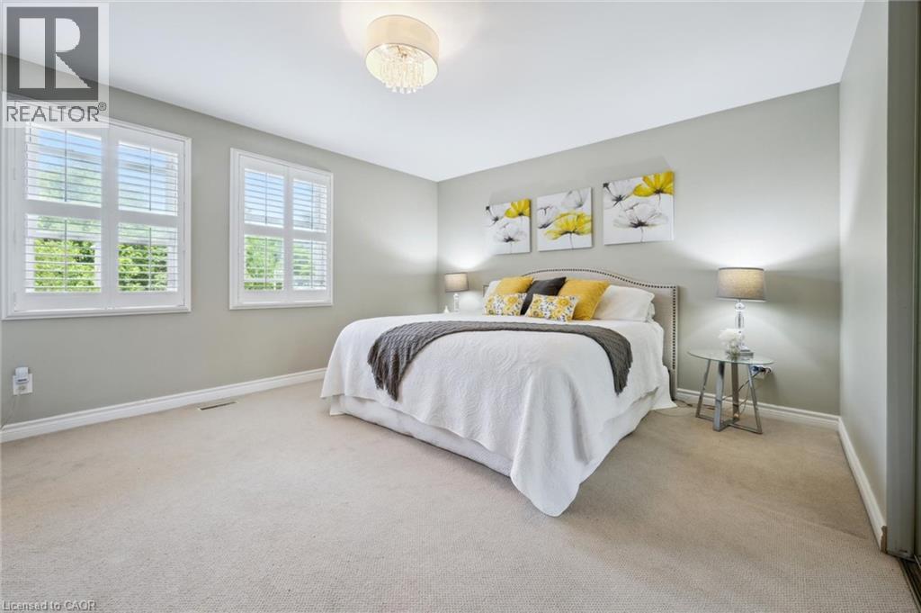Bedroom with light carpet and baseboards