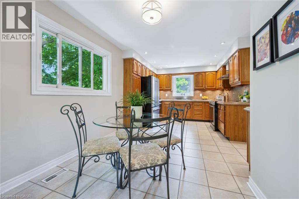 Dining room featuring light tile patterned floors and recessed lighting