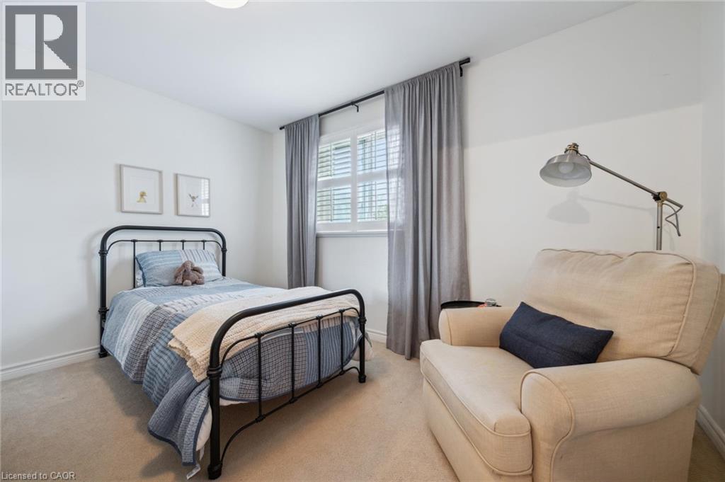 Carpeted bedroom with baseboards