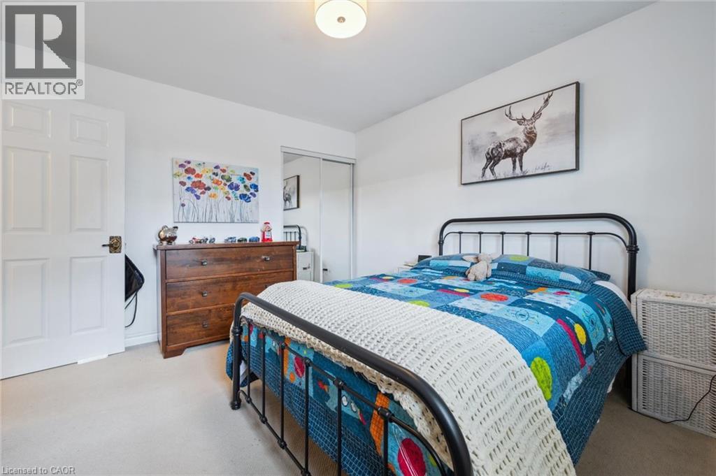 Bedroom featuring a closet and light colored carpet
