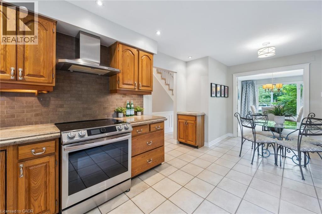 Kitchen featuring wood finish cabinets, electric range, and recessed lighting