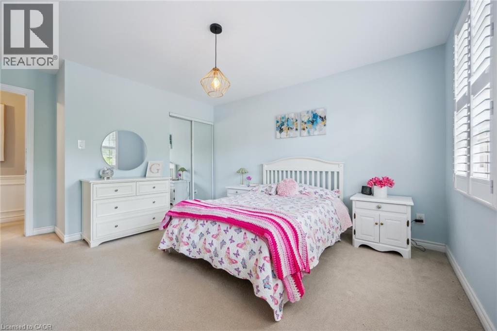 Bedroom featuring light carpet and a closet
