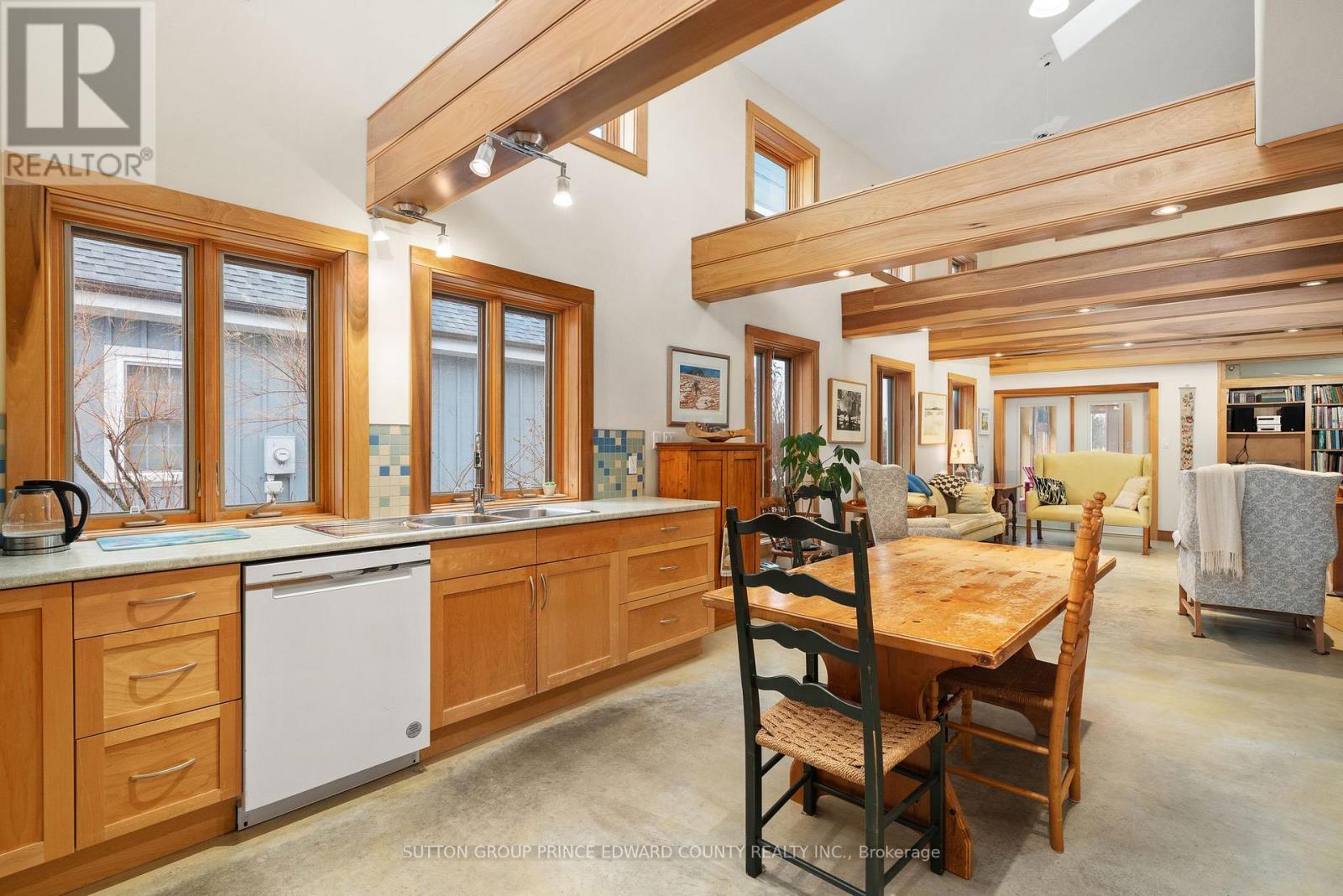 Kitchen flows into dining flows into living room