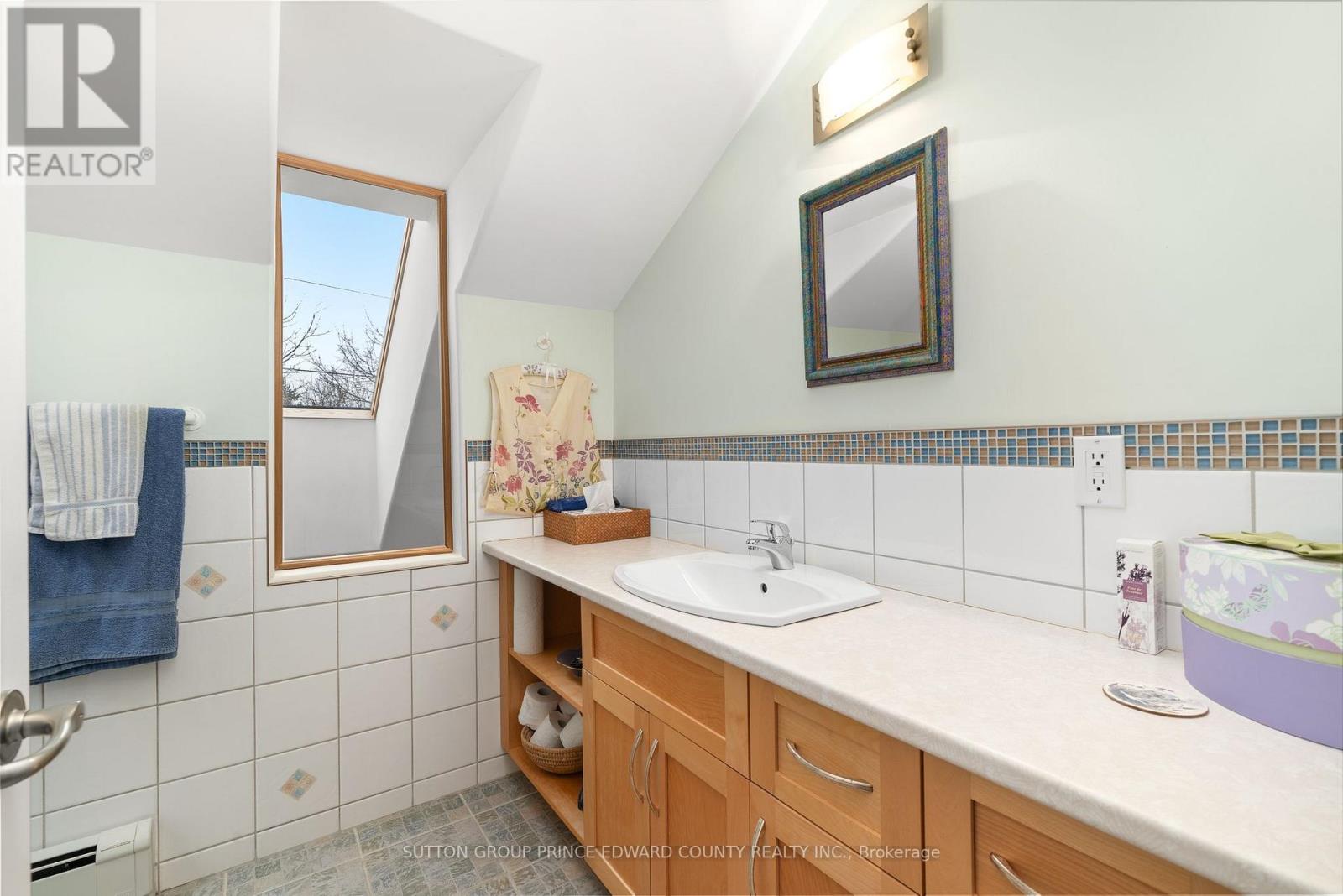 Guest bathroom has skylight for additional light