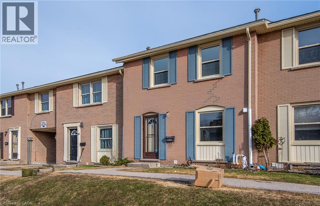 Colonial inspired home featuring brick siding