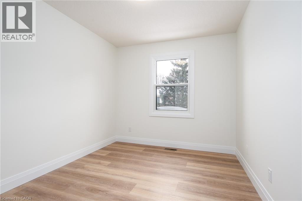 Unfurnished room with light wood-type flooring