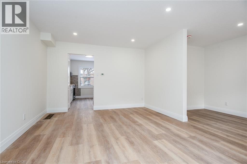 Spare room featuring light wood finished floors and recessed lighting