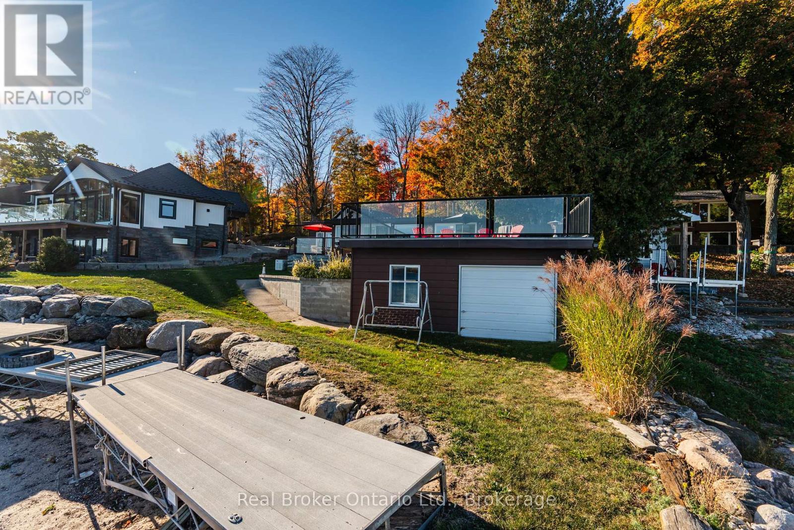 Boathouse with patio & hot tub above