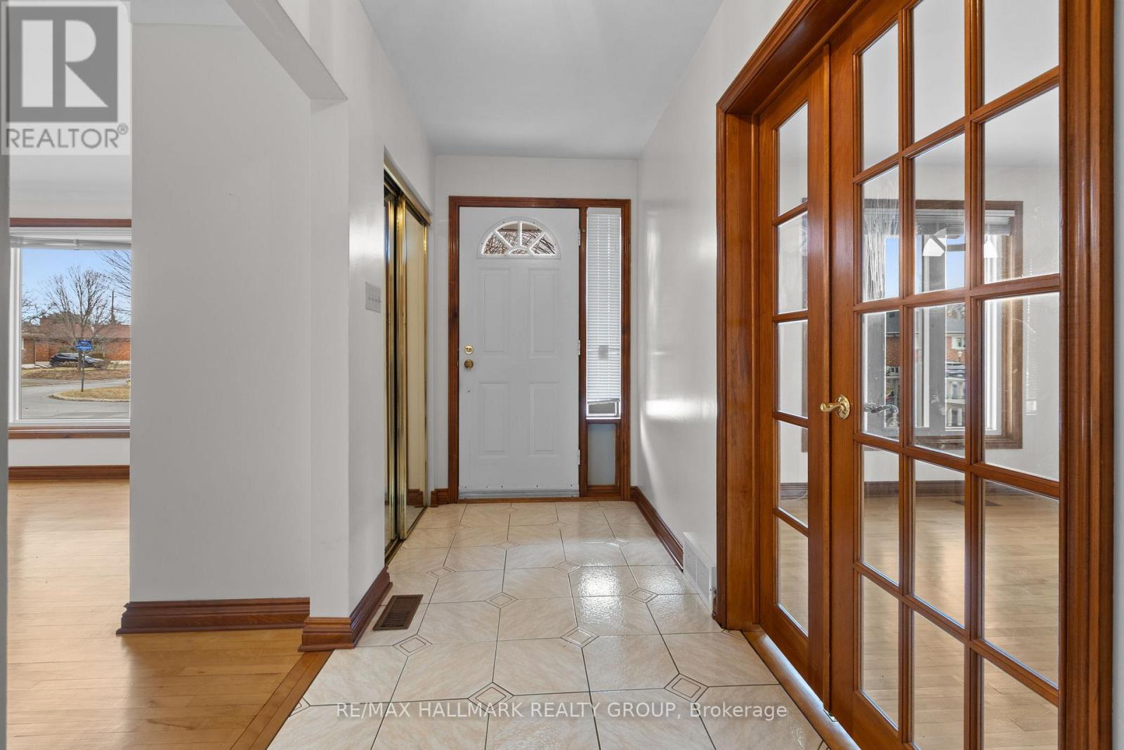 Bright Foyer With Mirrored Closets