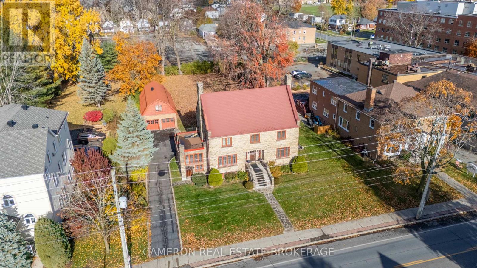 Aerial view of the home garage and lot