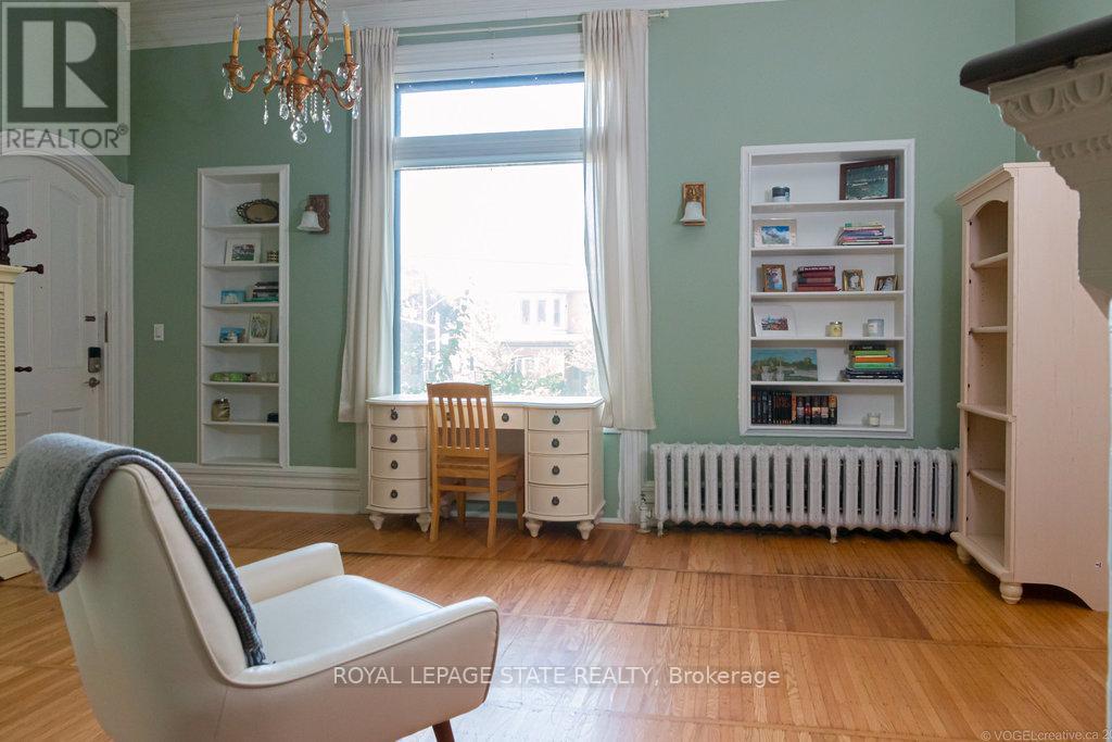 Unit 1 Foyer with closet & wood burning fireplace