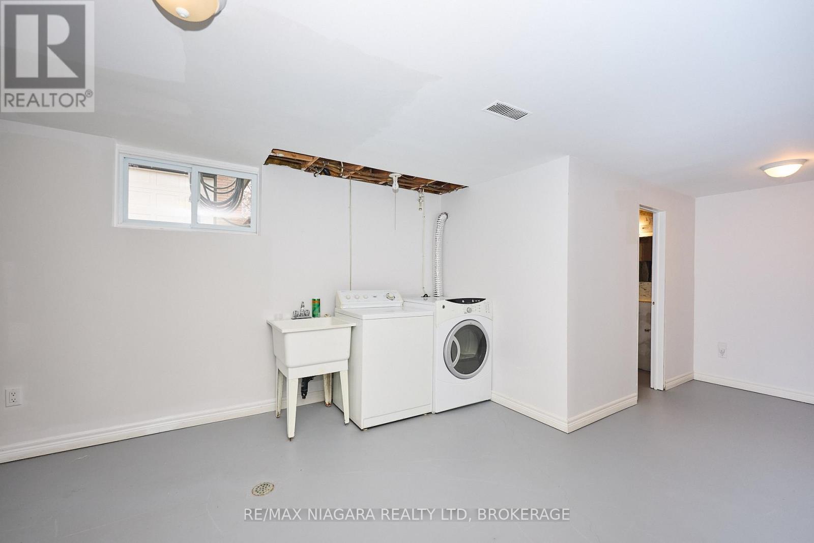 Laundry Area and door to 1pc Bathroom & rough-in