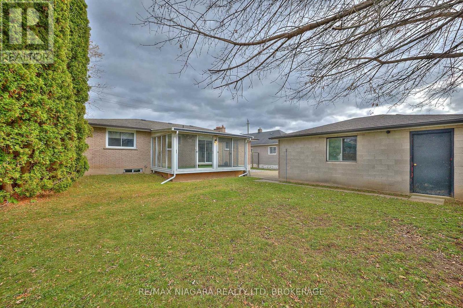 Backyard, sunroom and detached garage