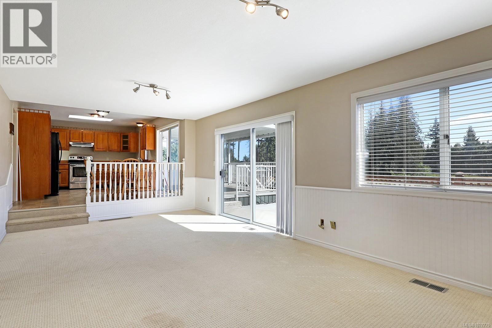 Family room w/glass sliding door to sunny back deck