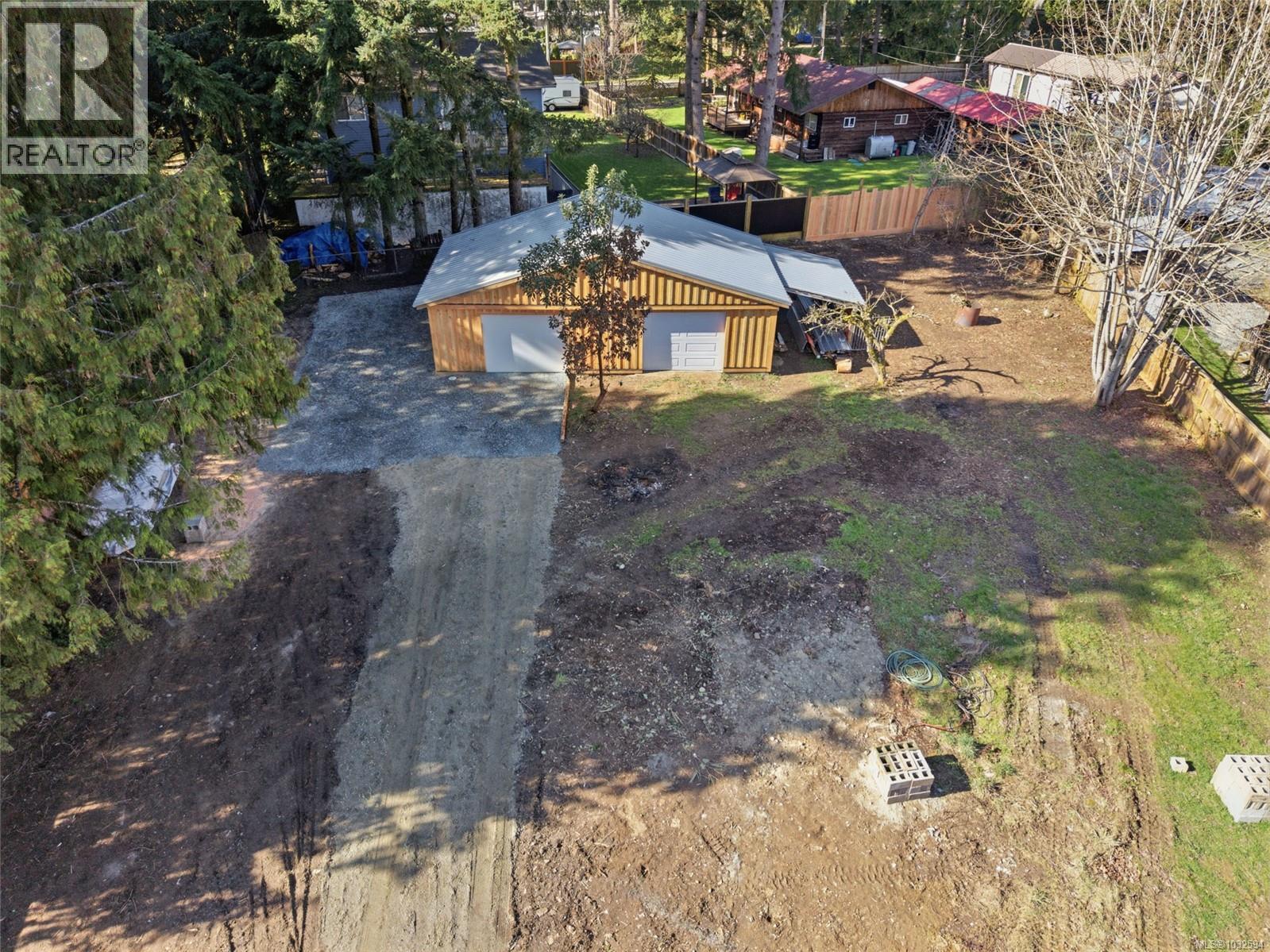 Driveway and lots of areas for flat parking and building
