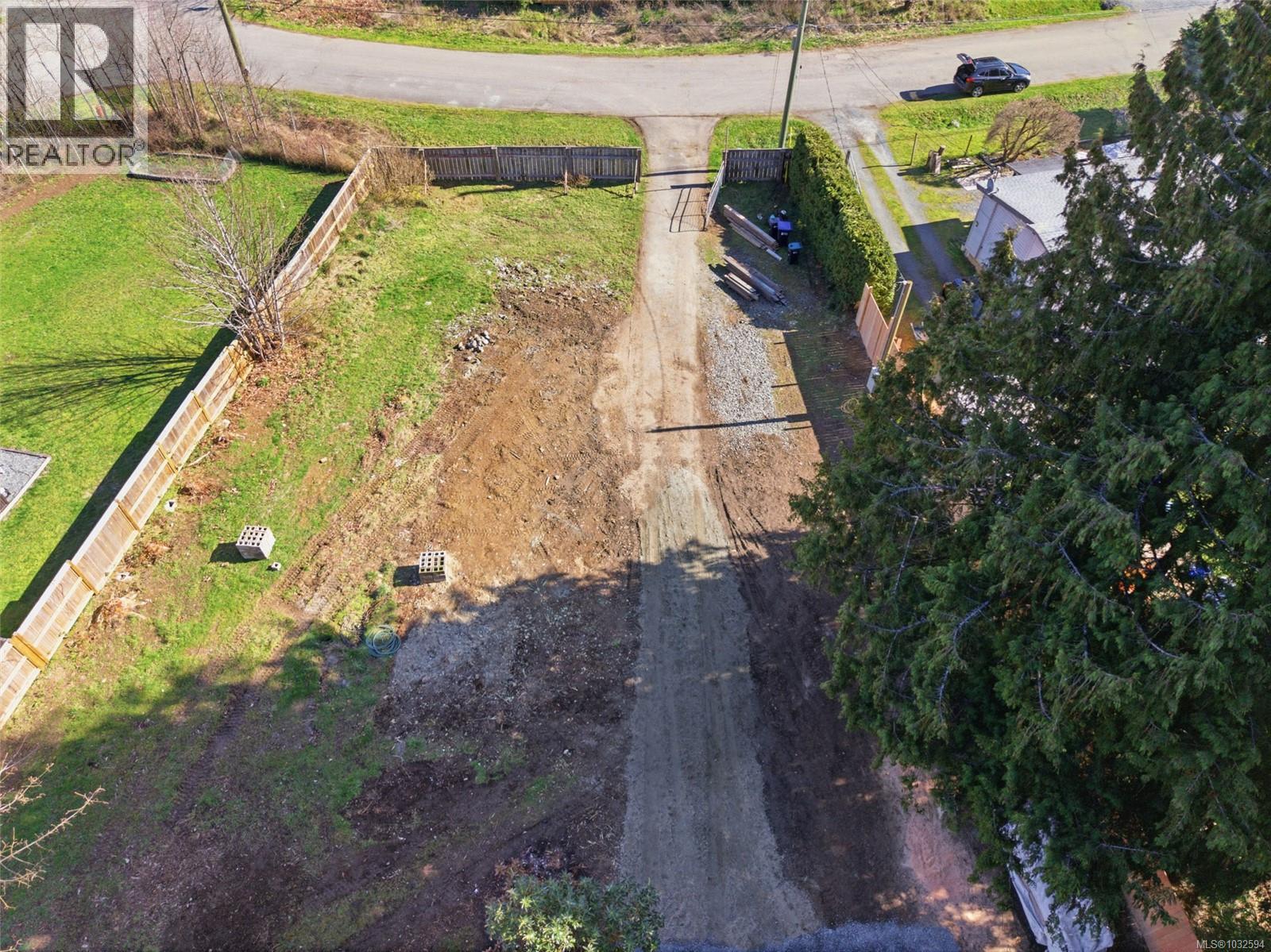 Driveway and lots of areas for flat parking and building