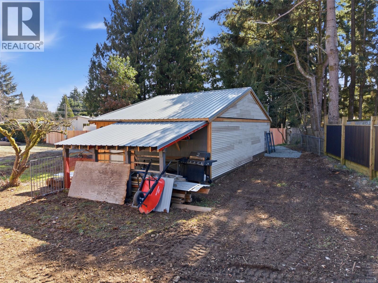 720 sq foot workshop/garage with covered storage on the side
