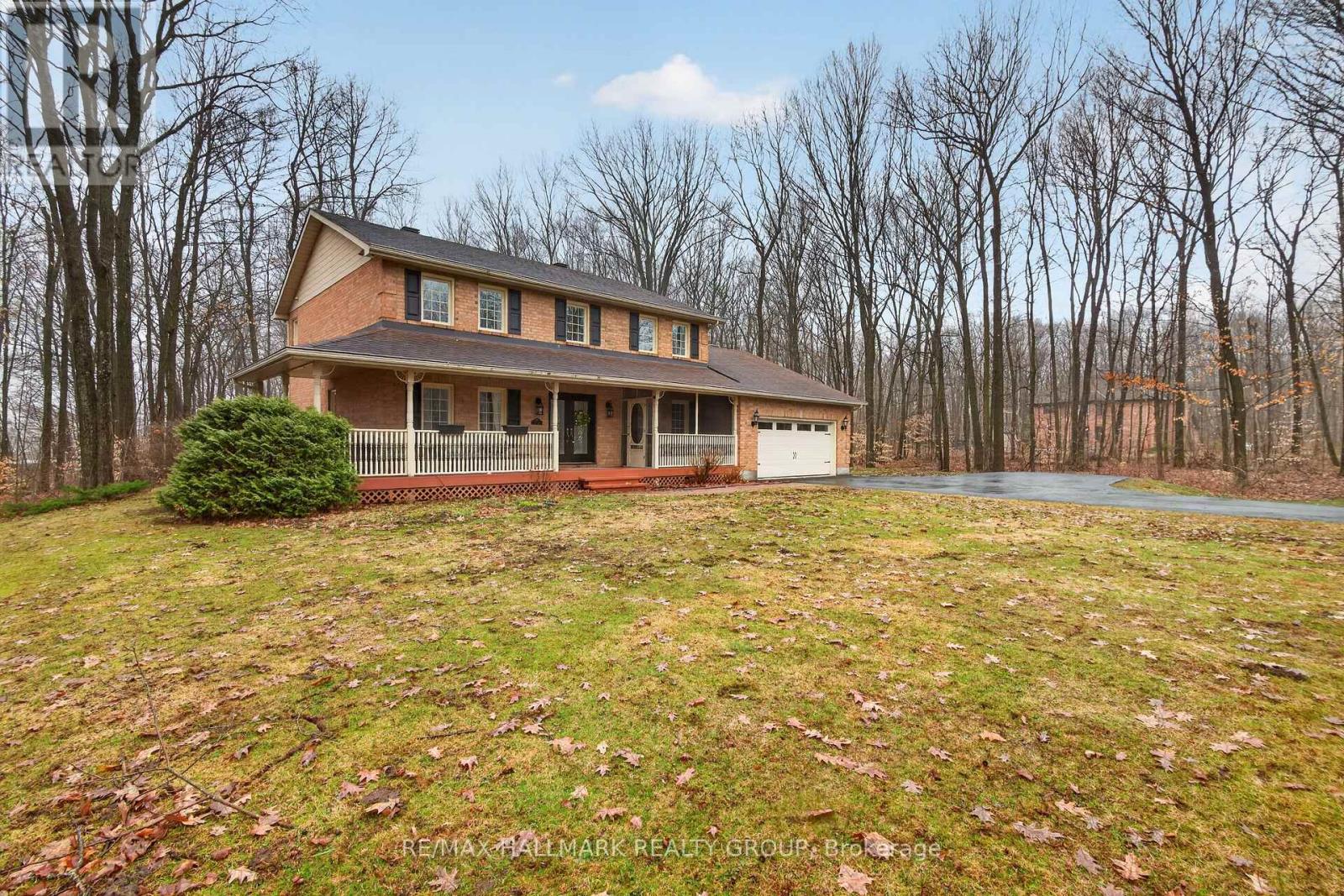 All-brick, 4 bedroom home on a wooded 1.98 acres