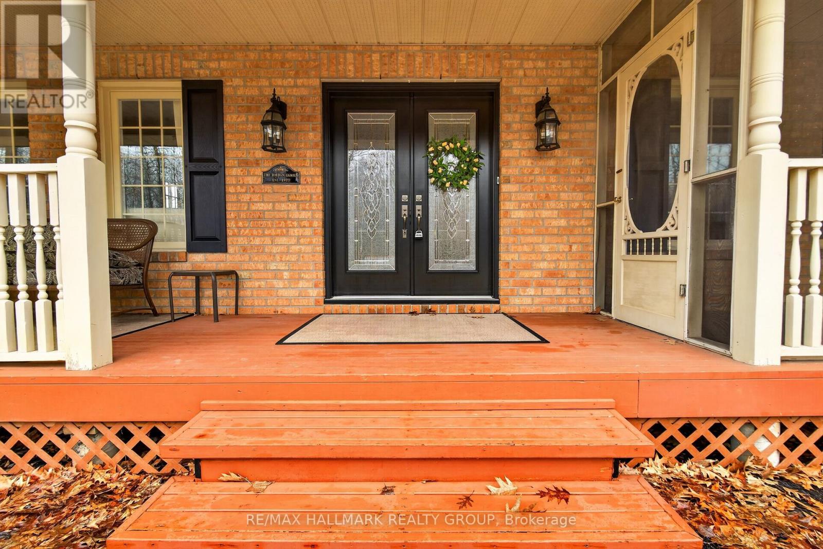Wrap-around front porch with screened in section
