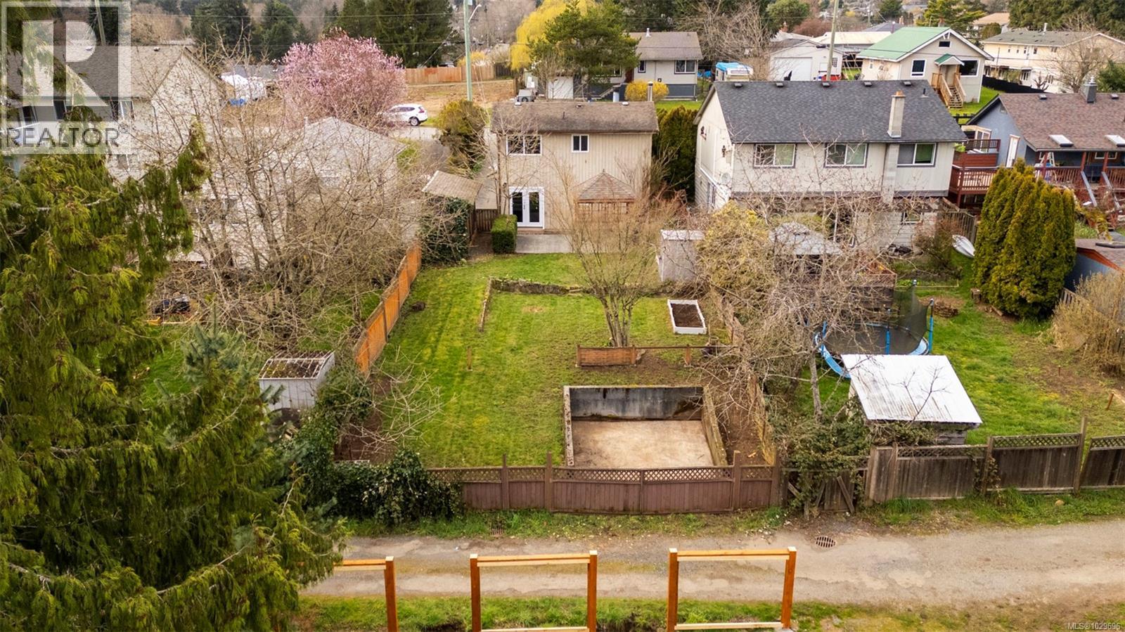 A great starter home with a lovely back yard with lane access