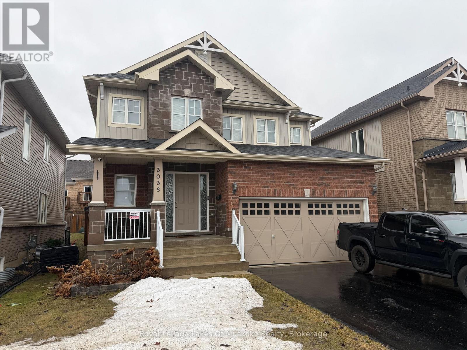 Landscaped front entrance, paved driveway