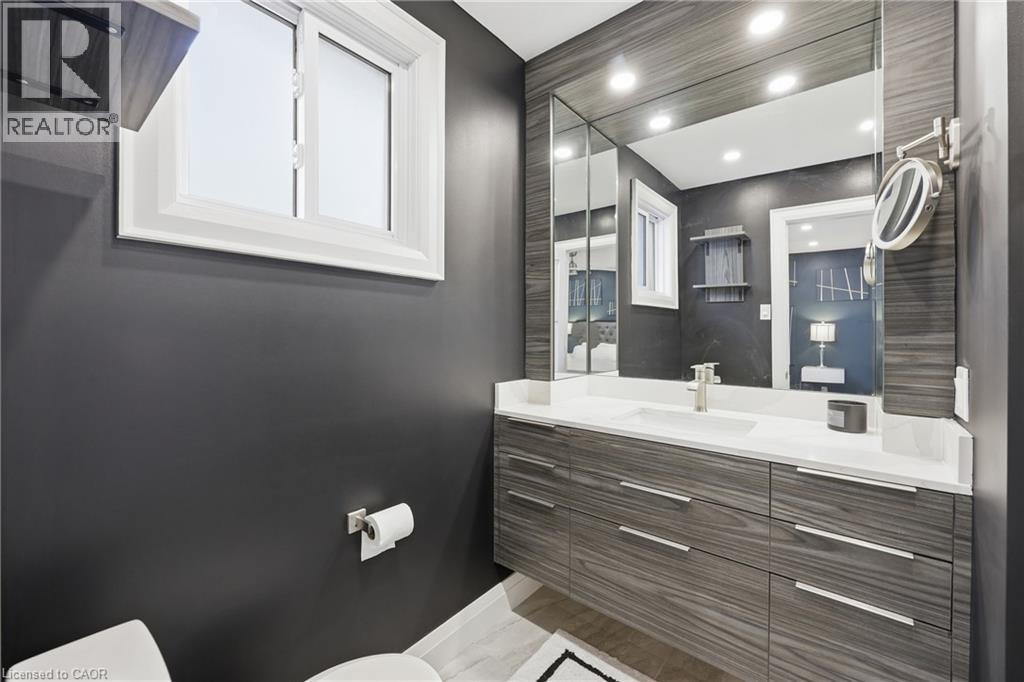 Bathroom featuring vanity and recessed lighting