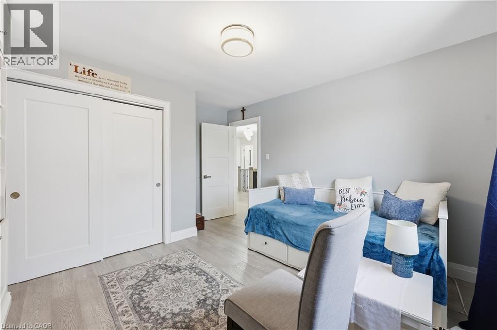 Bedroom with a closet and light wood finished floors