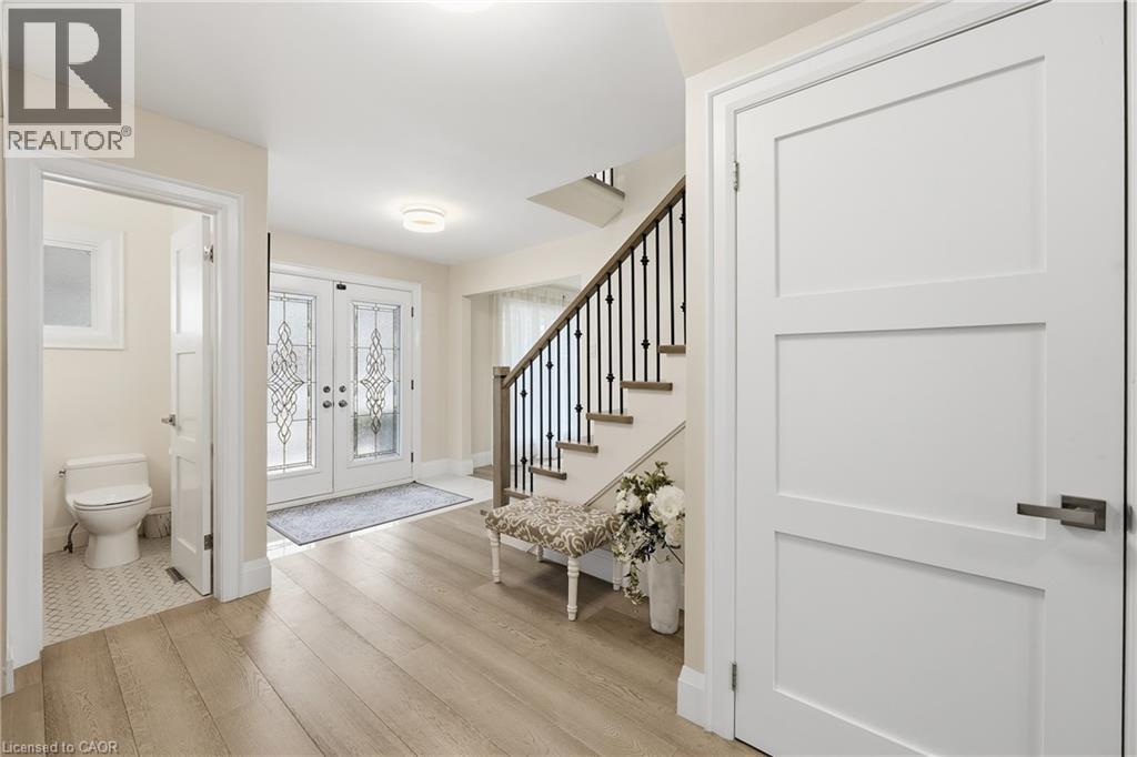 Entryway featuring light wood-type flooring and french doors