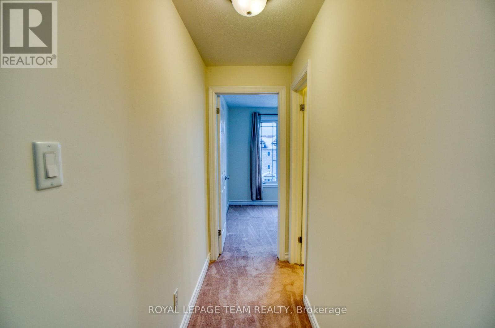 Hallway to den and powder room