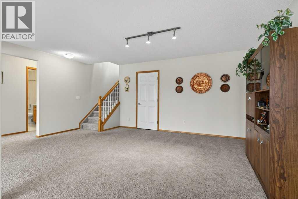 Single Family House Bungalow for Sale in  Arbour Wood Close NW Arbour Lake Calgary 