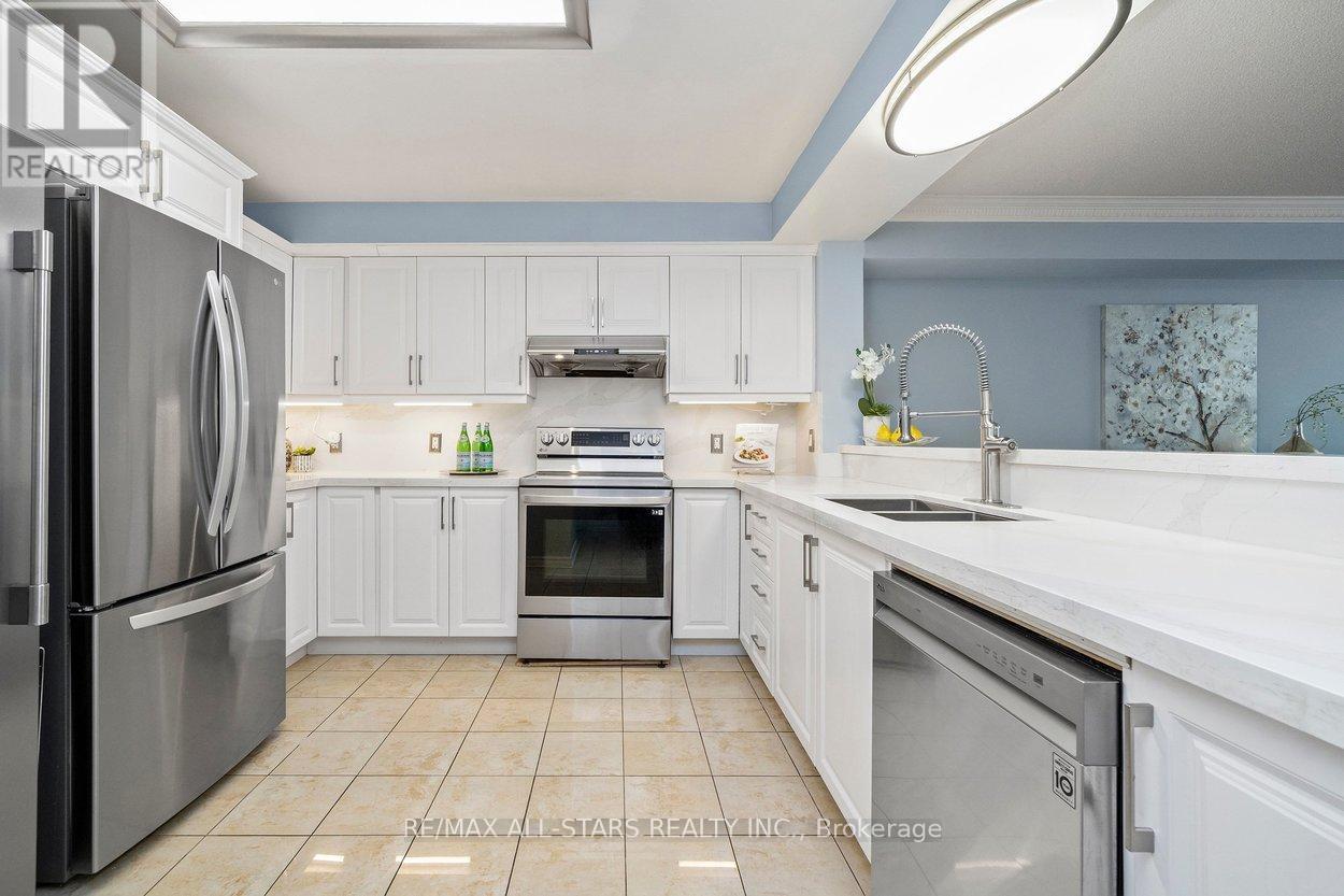 Renovated kitchen w quartz countertops.