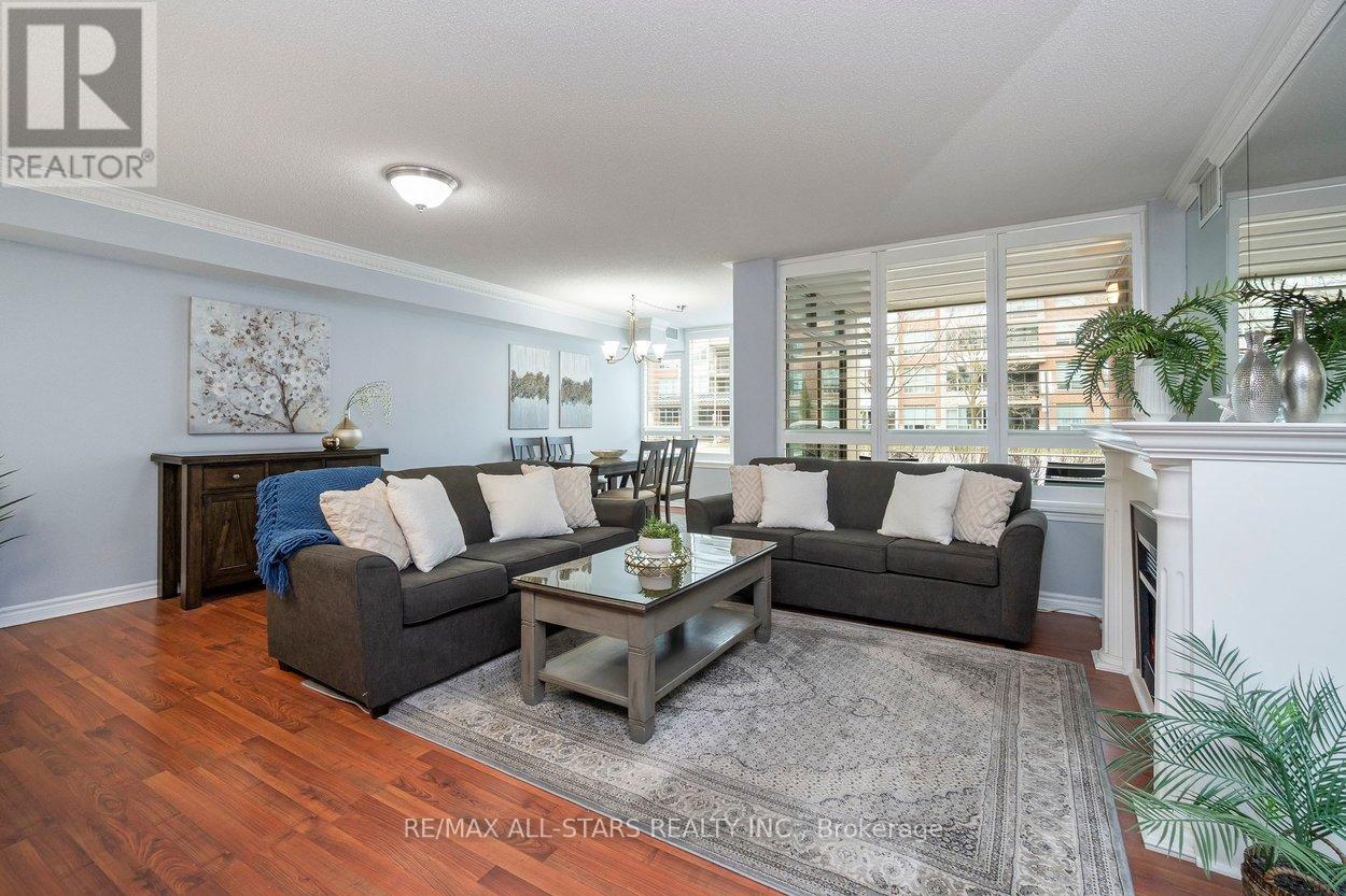 Open concept living, dining & sun room areas.